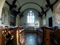The aisle and altar in Ludgershall Church. 